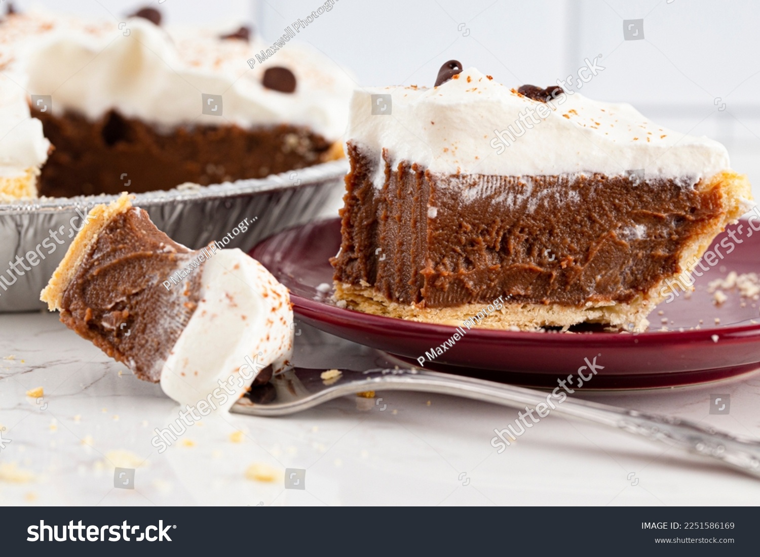 A Chocolate Cream Pie Topped with Chocolate Chips and Cocoa on Whipped Cream #2251586169