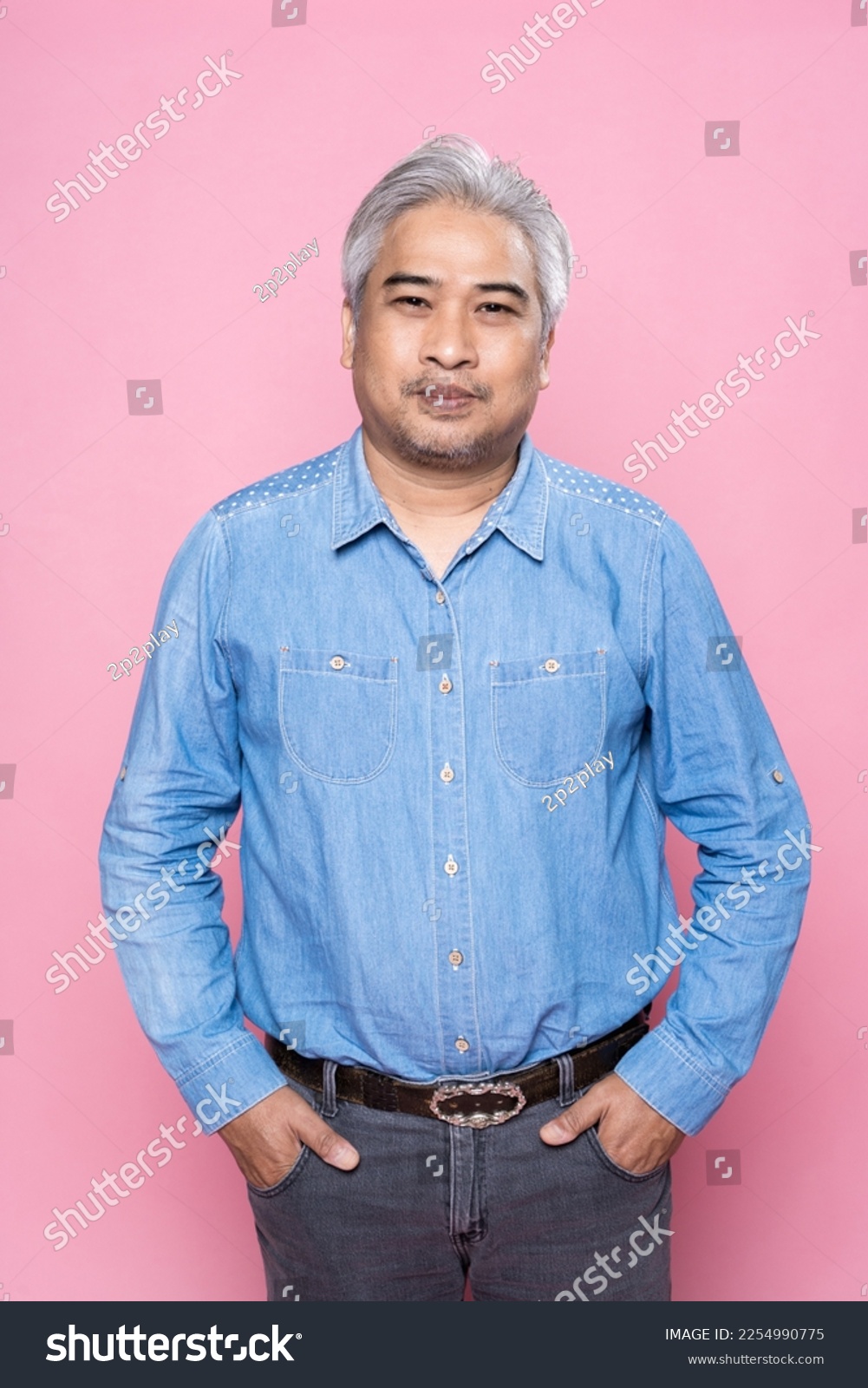 Portrait of senior man standing isolated on pink background, Happy elderly man gray hair in a blue shirt. #2254990775