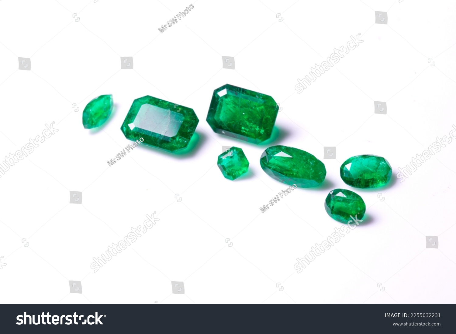 A collection of loose Emerald gemstones. Single stones for jewellery. Isolated on a white background #2255032231