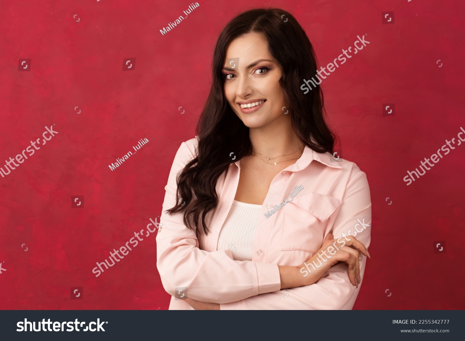 Beautiful dark-haired woman in a pink shirt on a pink background. Color of background Viva Magenta 18-1750, in 2023 #2255342777