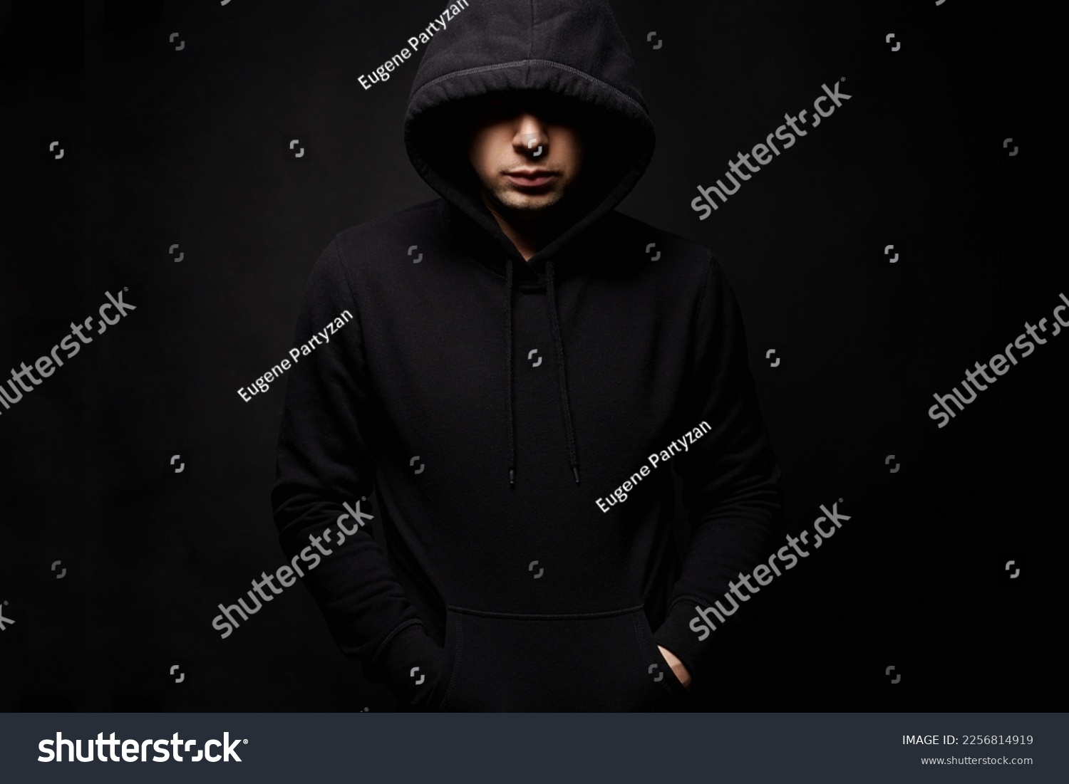 Person in Hood. Man or Boy in a hooded sweatshirt. Studio Shot #2256814919