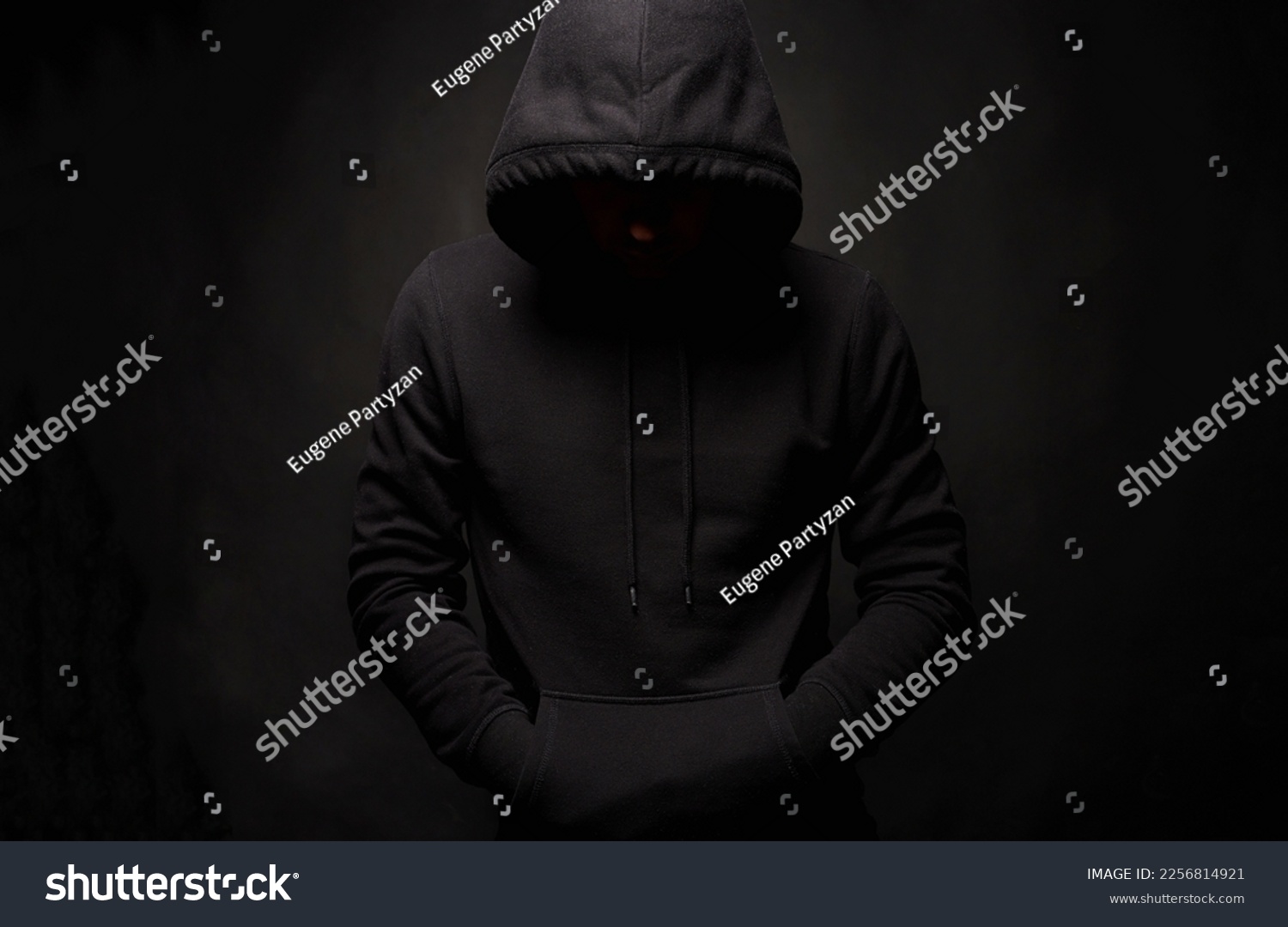 Person in Hood. Man or Boy in a hooded sweatshirt. Studio Shot #2256814921