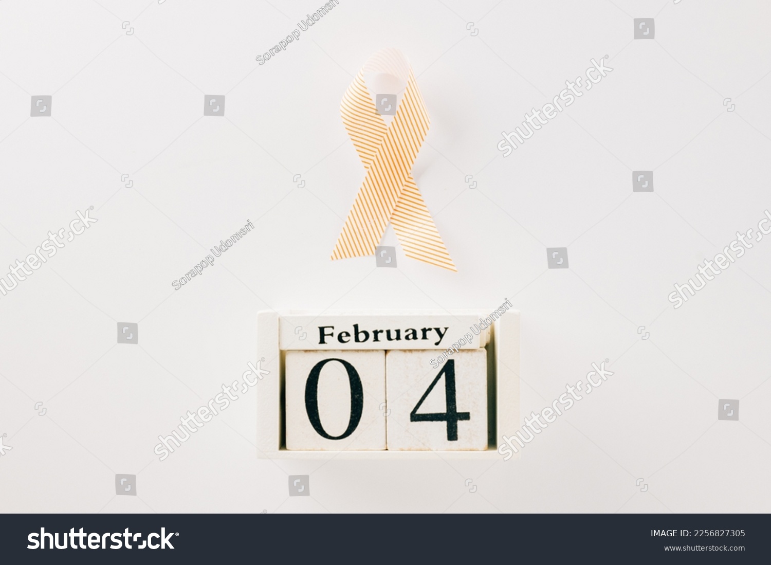 Pink awareness ribbon sign and Calender 4 February of World Cancer Day campaign isolated on white background with copy space, concept of medical and health care support #2256827305