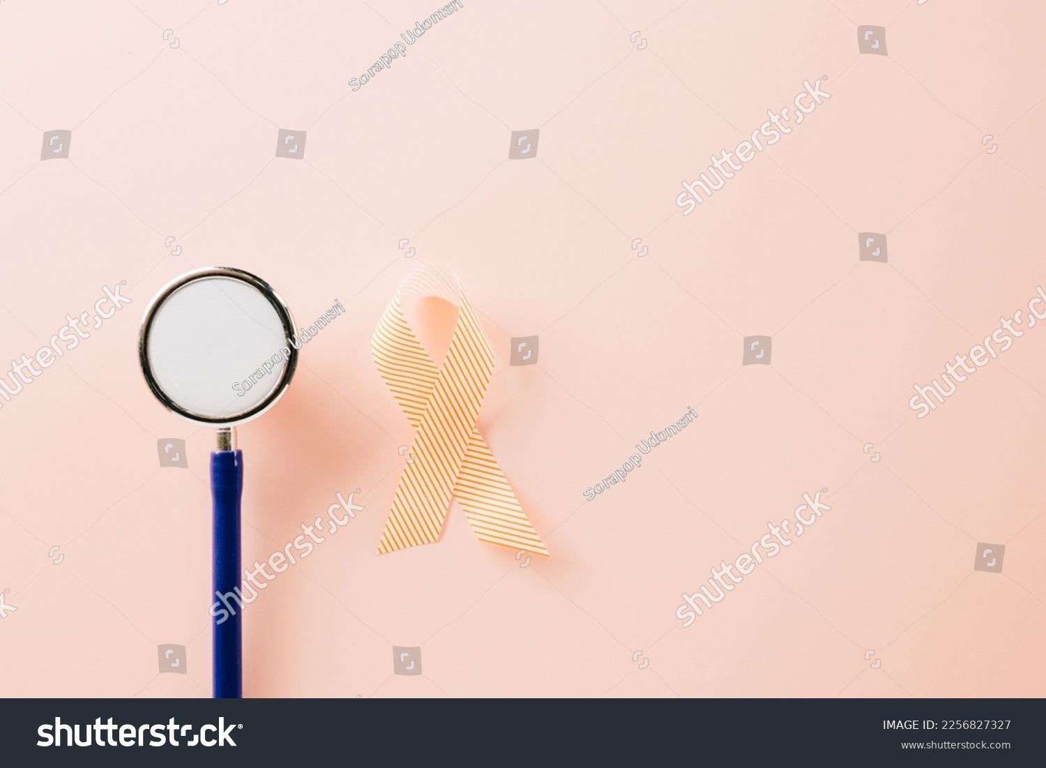 Pink awareness ribbon sign and stethoscope of International World Cancer Day campaign month on pastel pink background with copy space, concept of medical and health care support, 4 February #2256827327