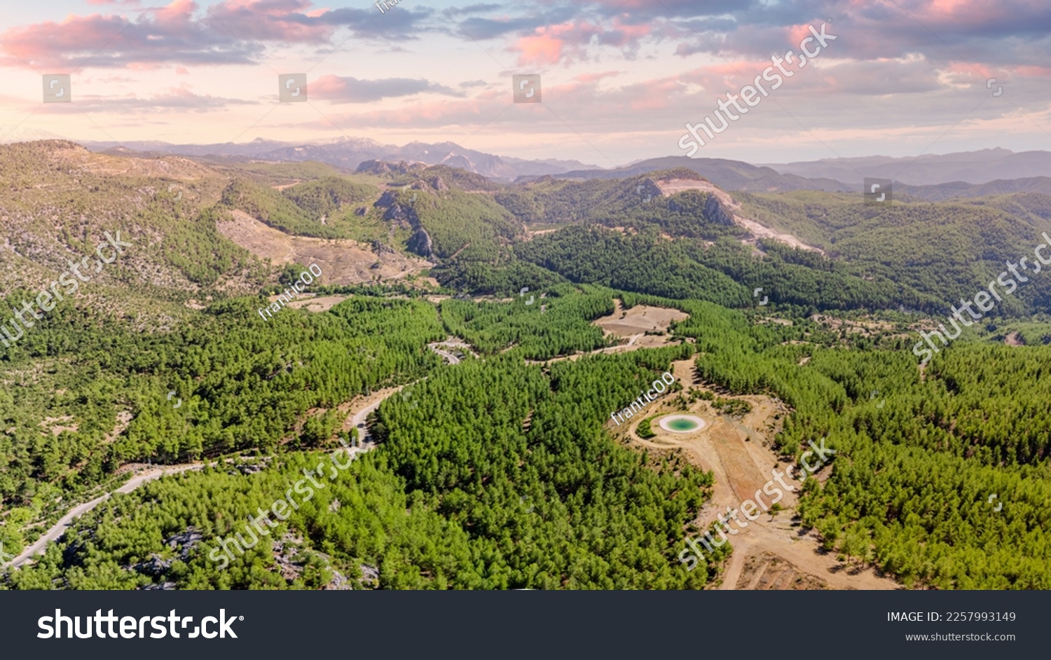 Firefighting artificial pond with water in mountain forest. Aerial view #2257993149