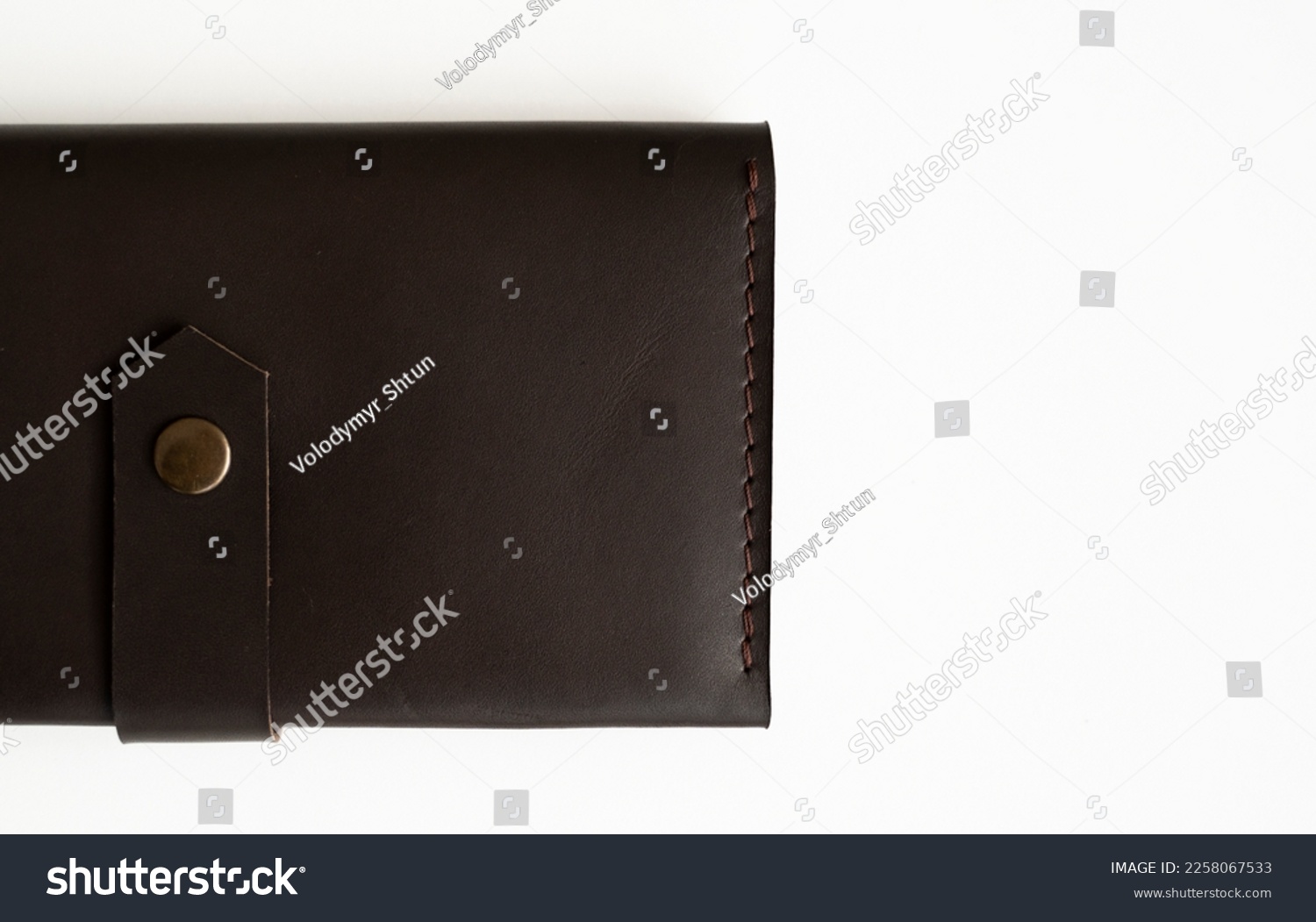 Wallet made of genuine black leather with a slots for cards and big zip pocket on a white background. Accessories for men. #2258067533