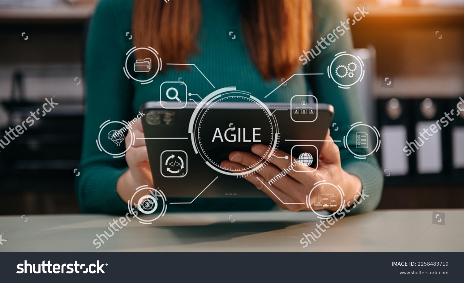 Agile development methodology concept. Business hand using laptop computer and tablet with virtual screen Agile icon on modern office digital technology concept. #2258483719