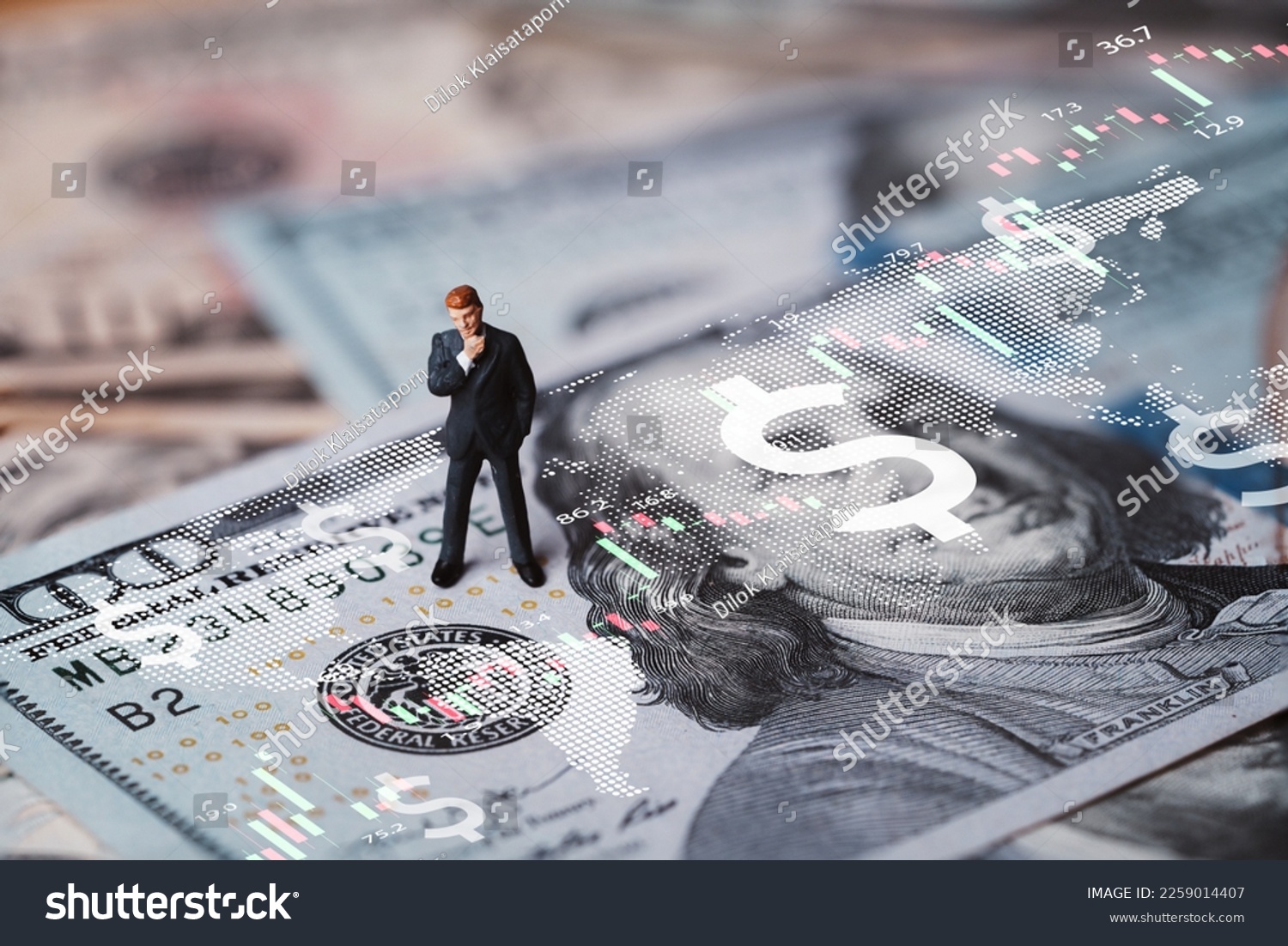 Businessman miniature figure standing on USD banknote with stock market chart graph for currency exchange of global trade forex and Fed increase interest rate to stop inflation concept. #2259014407