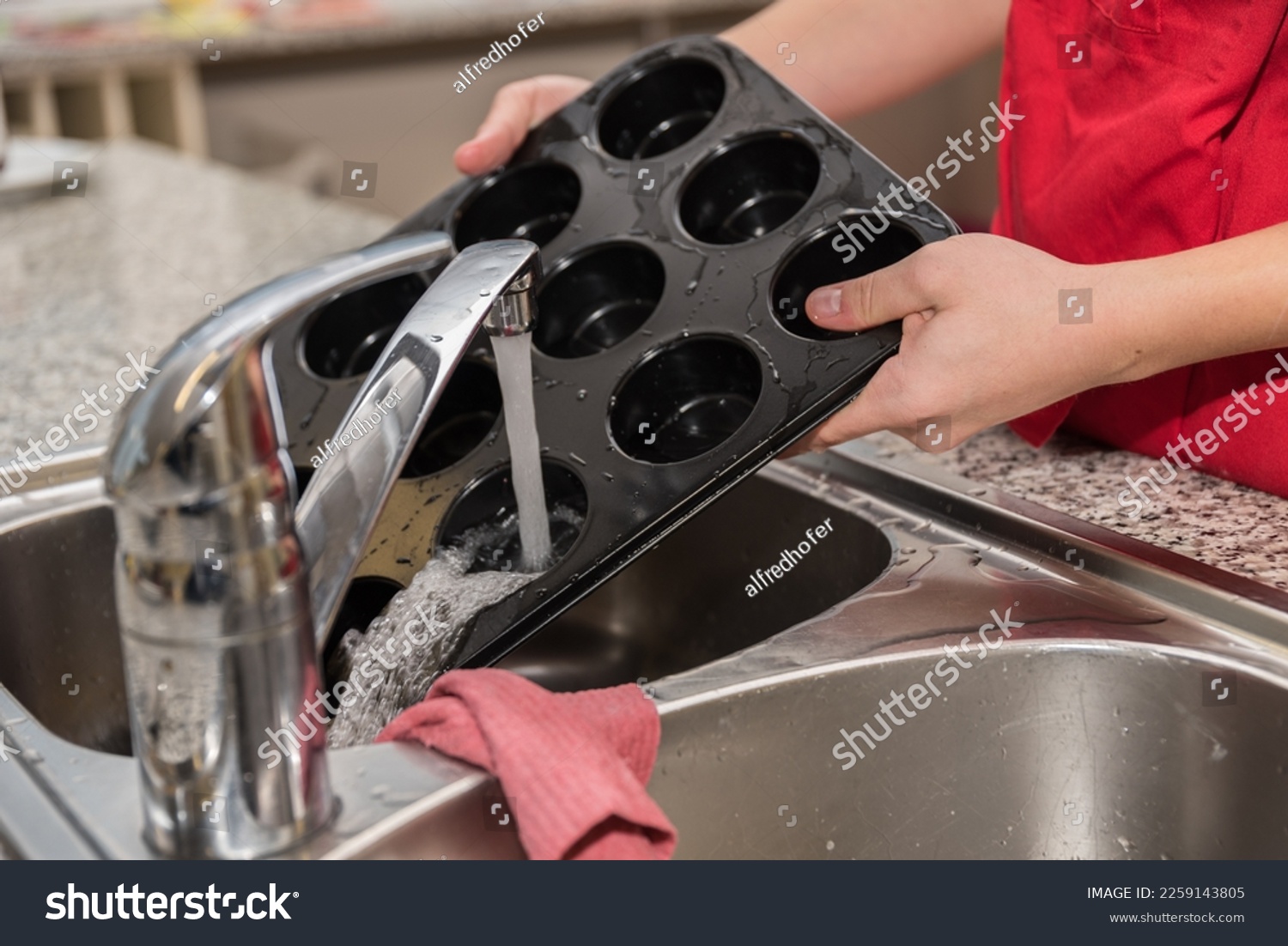 On the dishes, dishes are washed off - close up sink #2259143805