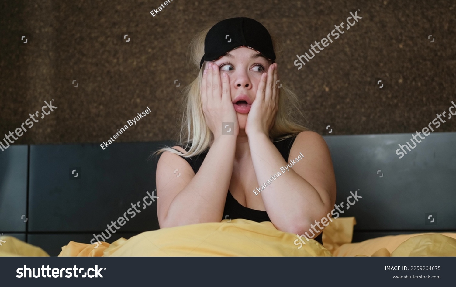 Shocked young woman wakes up with anxiety. Woman overslept #2259234675