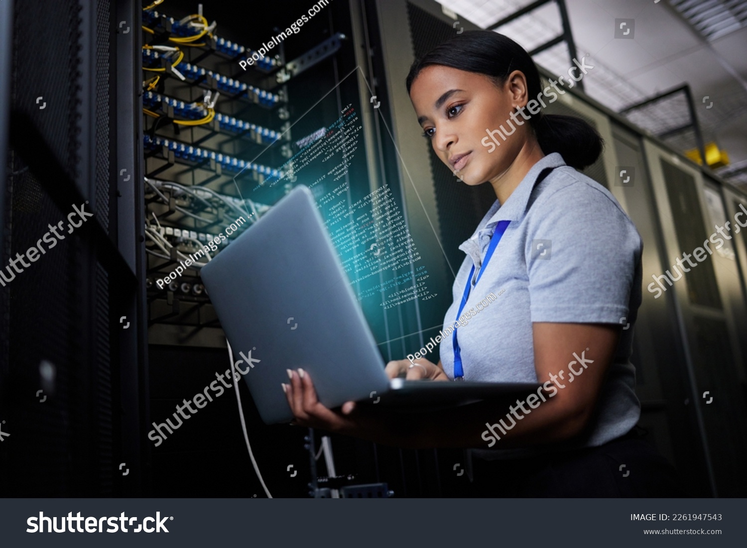 Laptop, network and data center with a black woman it support engineer working in a dark server room. Computer, cybersecurity and analytics with a female programmer problem solving or troubleshooting #2261947543