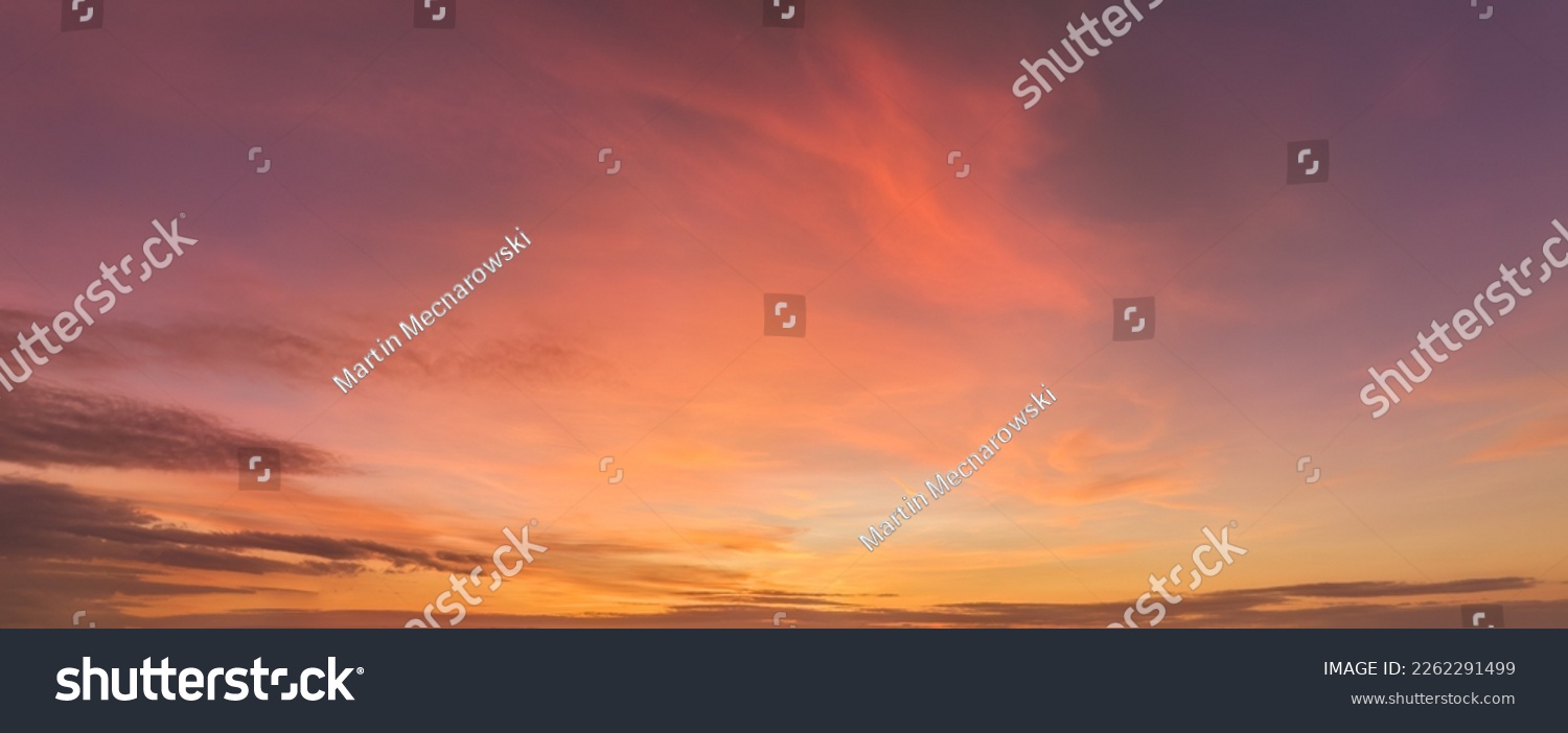 
Aerial, panoramic view  of colorful, pink and red colored evening sky without obstacles in the front. Ideal for sky replacement projects.  #2262291499