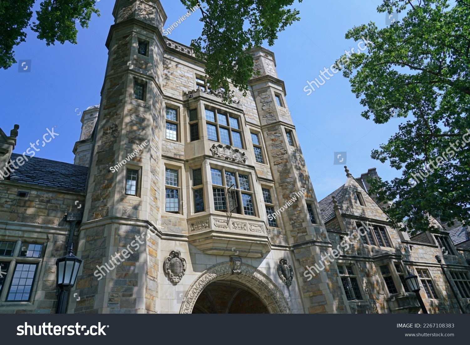 Ann Arbor, Michigan -  Campus of the University of Michigan with traditional gothic style stone buildings with gables #2267108383