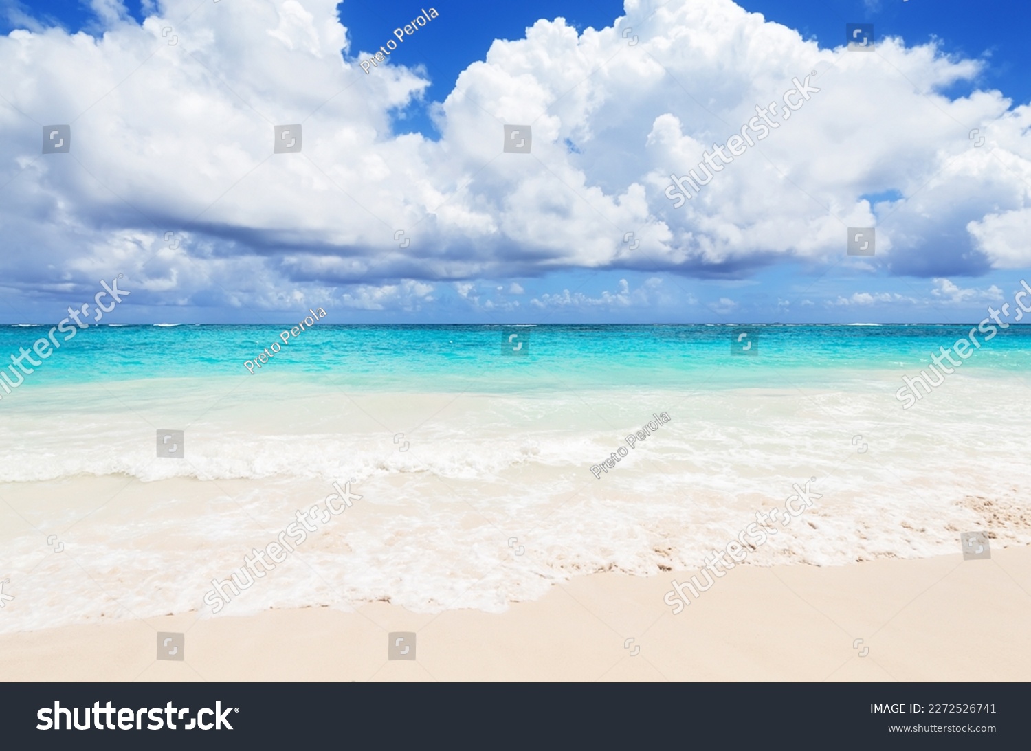 Landscape view of beautiful tropical white sand beach and turquoise sea in sunny day in Punta Cana, Dominican Republic. Empty tropical beach background. Horizon with sky and white sand #2272526741