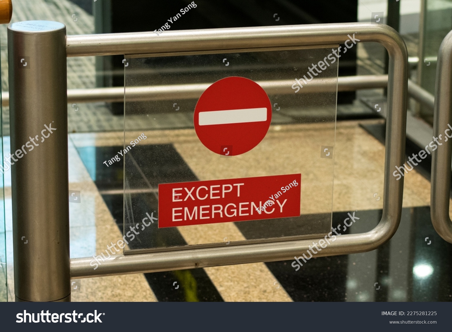 Metal gate with red no entry sign, except emergency #2275281225