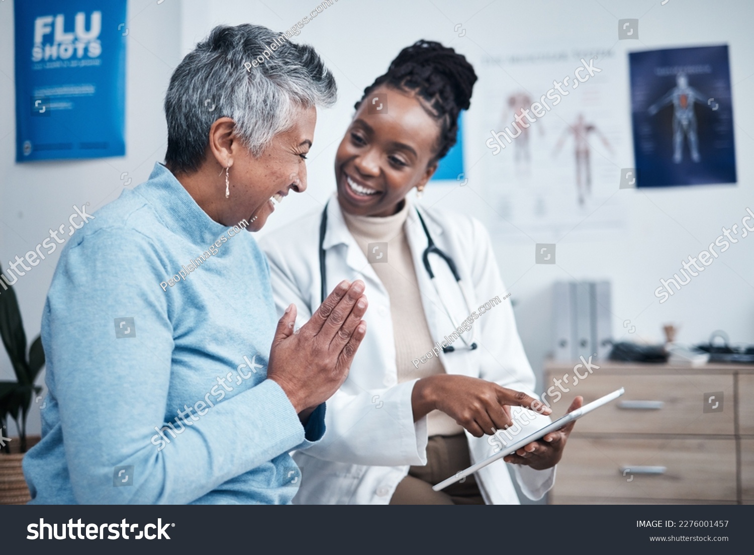 Black woman, doctor and elderly patient with good news, tablet and results for health, advice and report. Happy african medic, mobile touchscreen or healthcare with smile, tech or support in hospital #2276001457