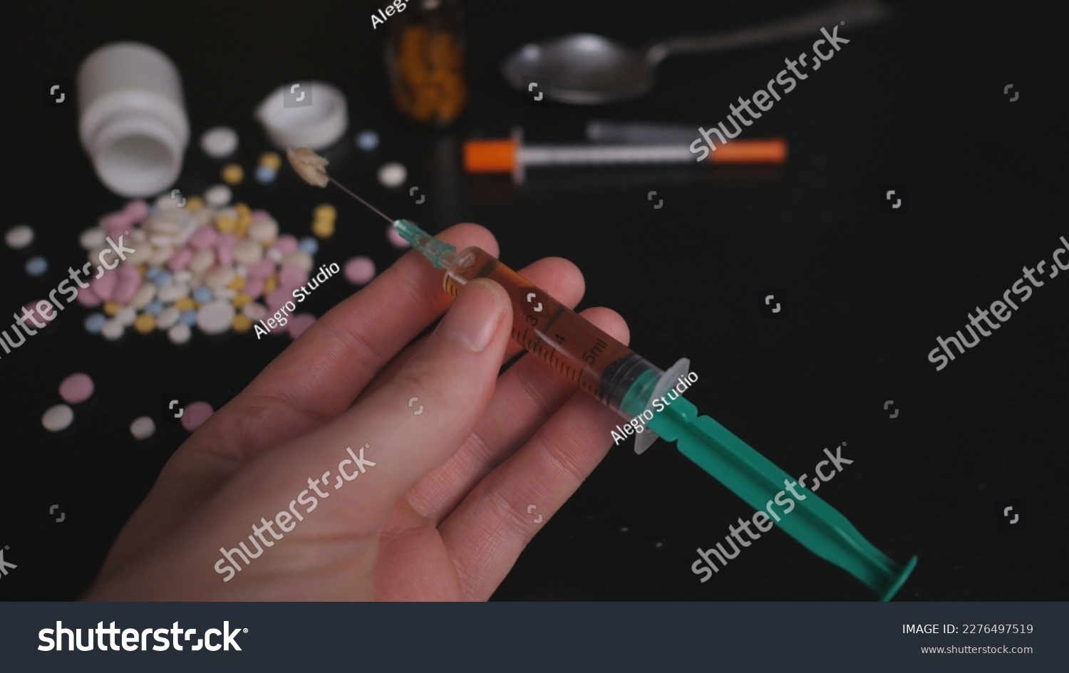 addict's table pills and injection on the black table #2276497519