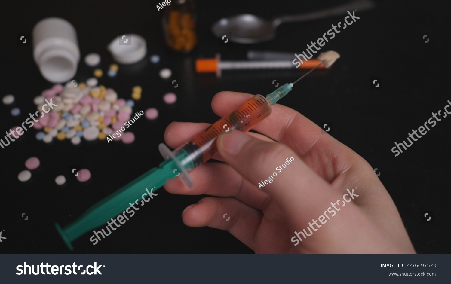 addict's table pills and injection on the black table #2276497523