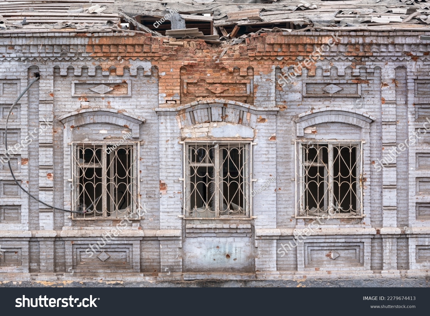 destroyed and burned houses in the city during the war in Ukraine #2279674413