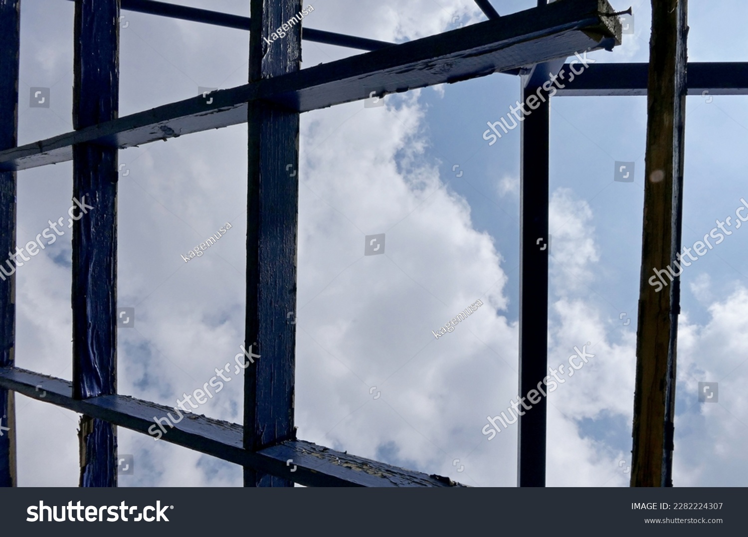industrial background with a building's blue wooden lines #2282224307