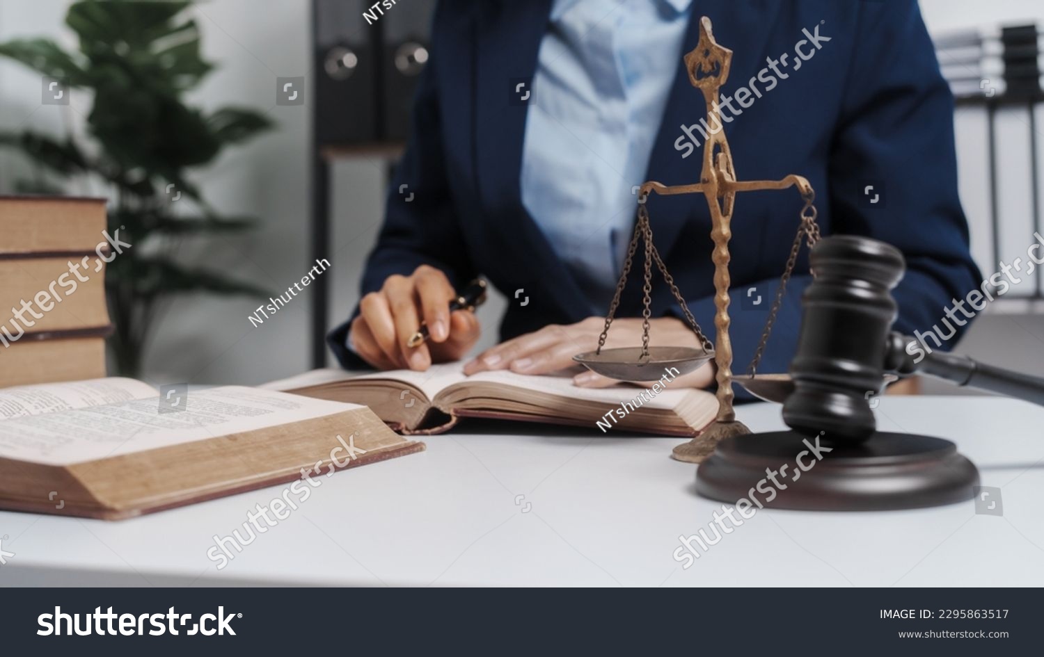 Young single female lawyer asian people in formal suit real estate working law book and contract documents, Arguments for Defense Strategy. Fight for Freedom. Supporting Evidence. #2295863517