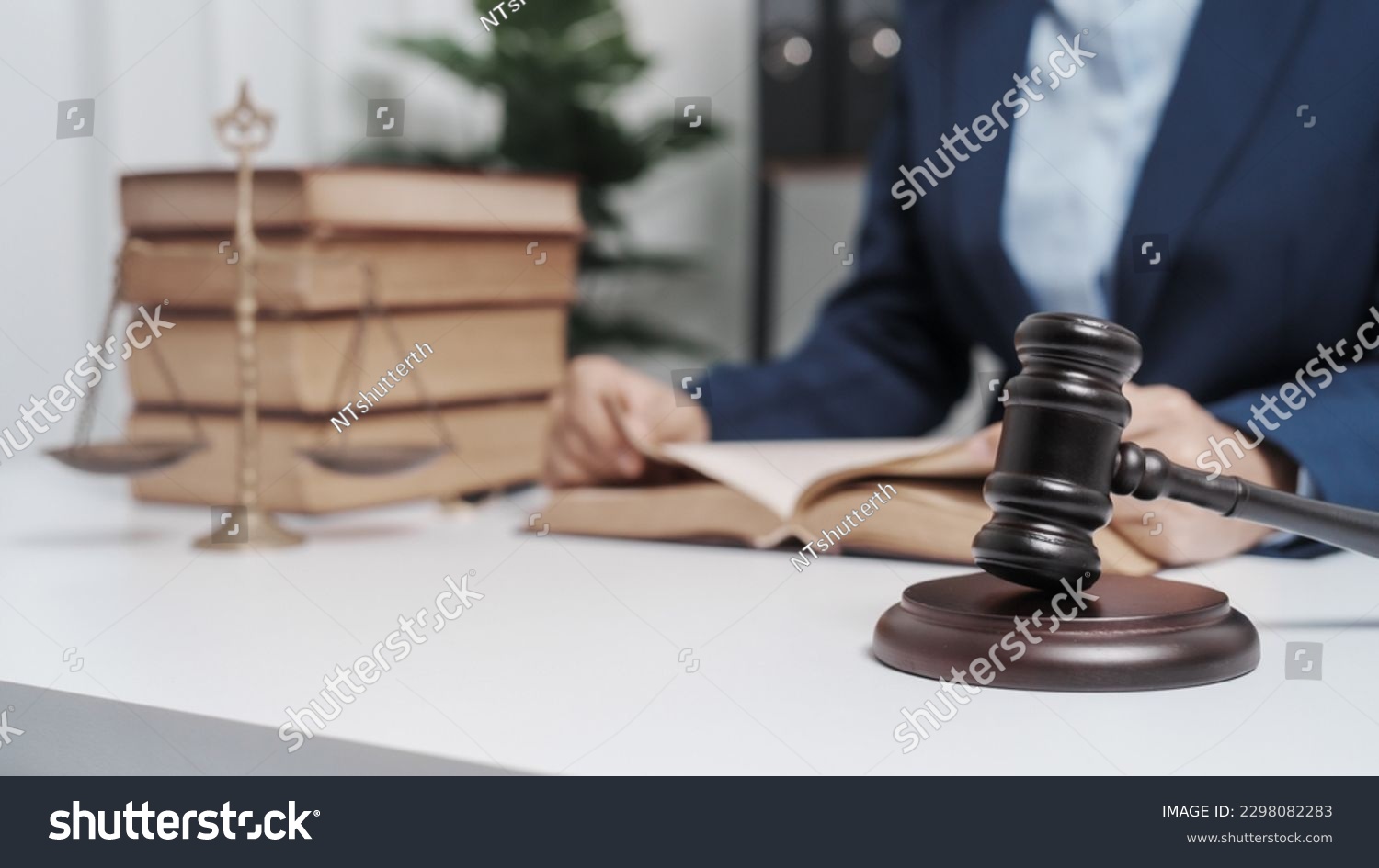 Young single female lawyer asian people in formal suit real estate working law book and contract documents, Arguments for Defense Strategy. Fight for Freedom. Supporting Evidence. #2298082283