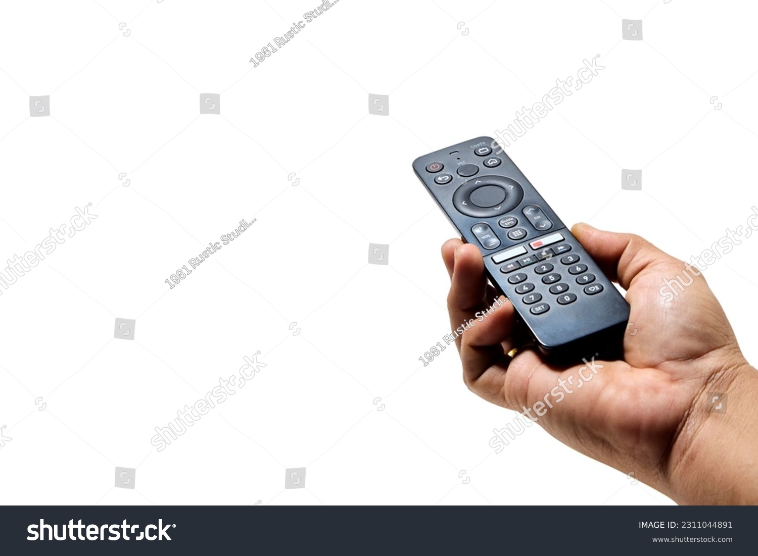 Hand holding television and audio remote control isolated on white background with clipping path #2311044891