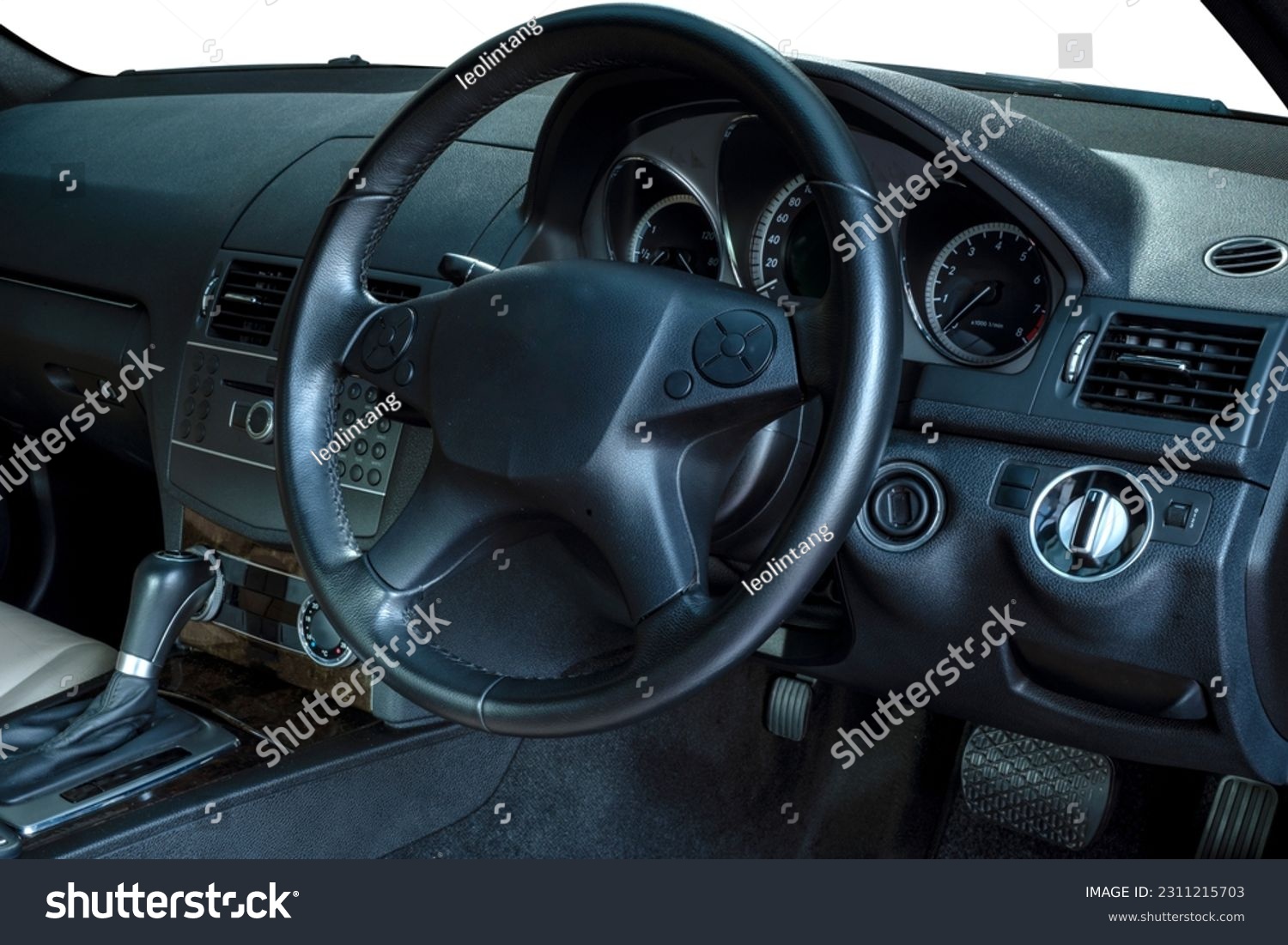 Steering wheel, shift lever, dashboard, speedometer display. Modern car interior #2311215703