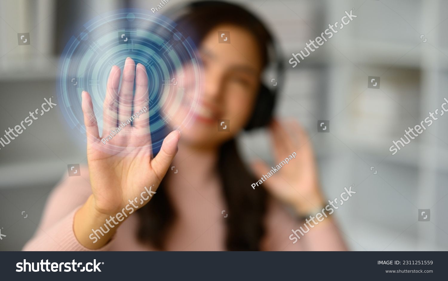 Smiling young woman wearing headphone, pressing button on virtual screen. Future technology, innovation and cyberspace #2311251559