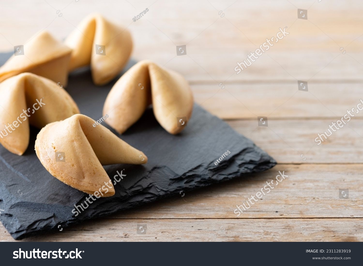 Traditional fortune cookies on wooden table. Copy space #2311283919