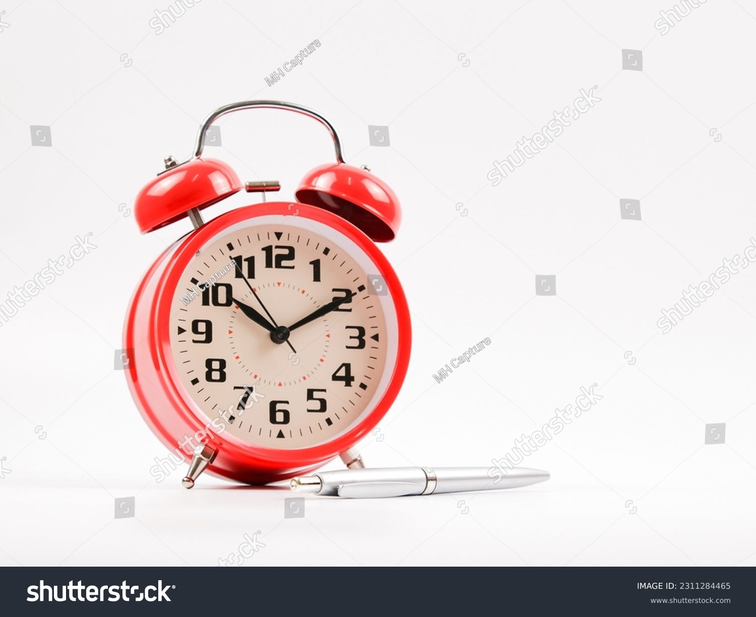 A clock and pen. Isolated with white background. #2311284465