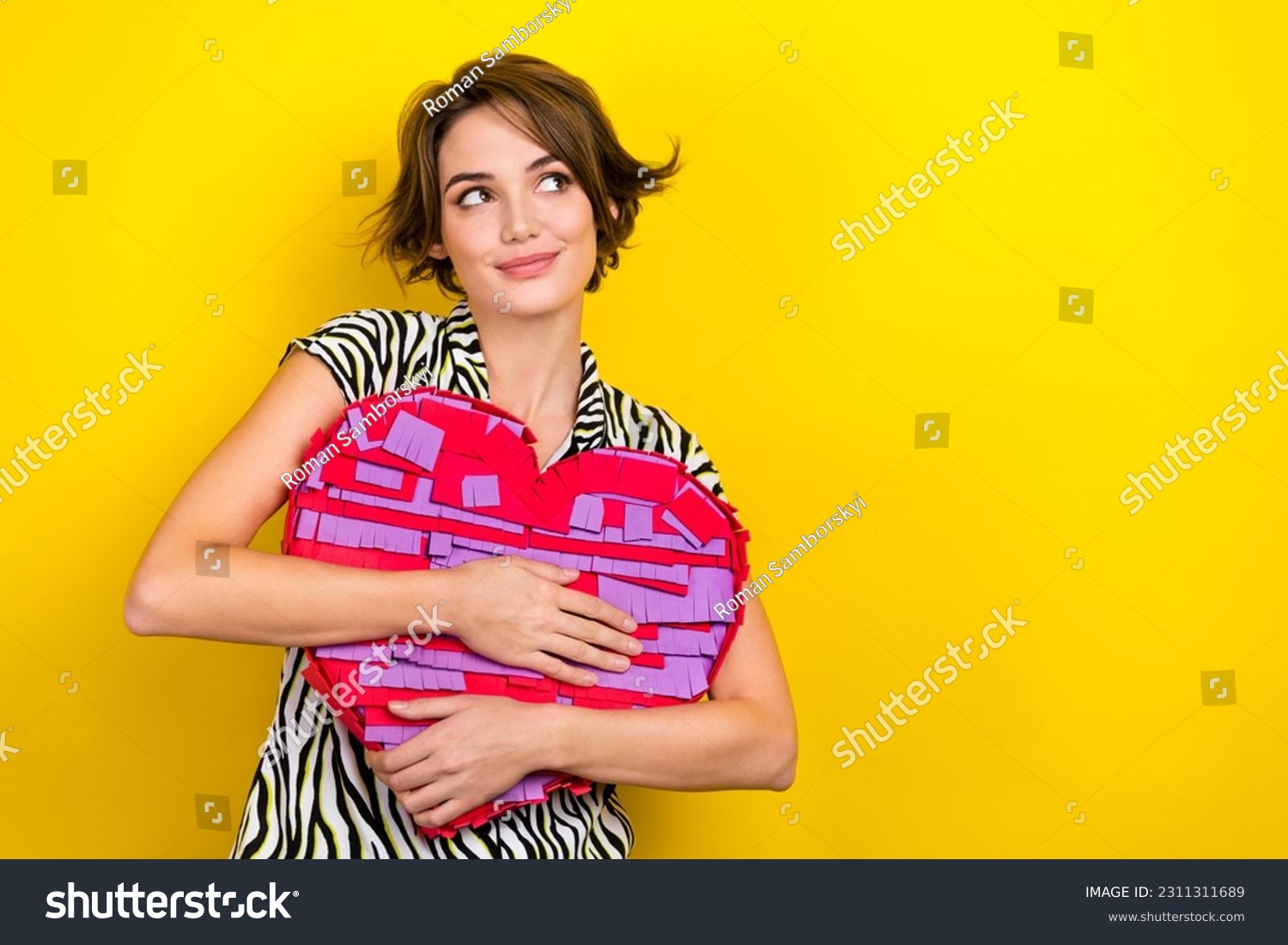 Photo of sweet lovely girl with bob hairdo dressed zebra print shirt hug big heart look empty space isolated on yellow color background #2311311689
