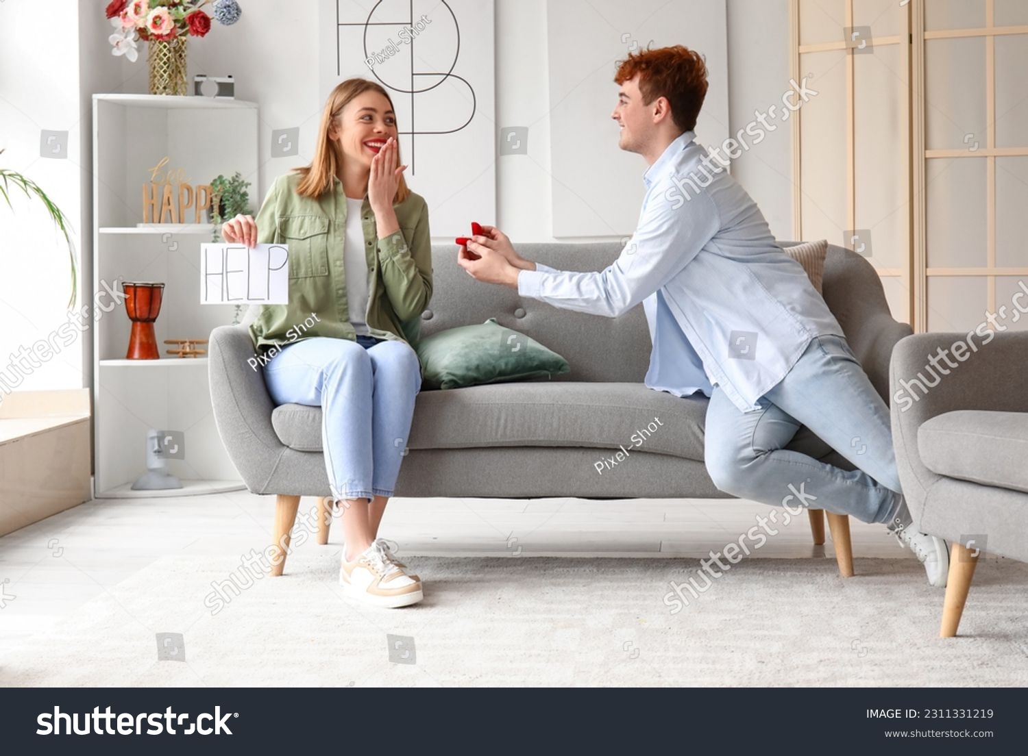 Young woman with word HELP get proposed at home #2311331219