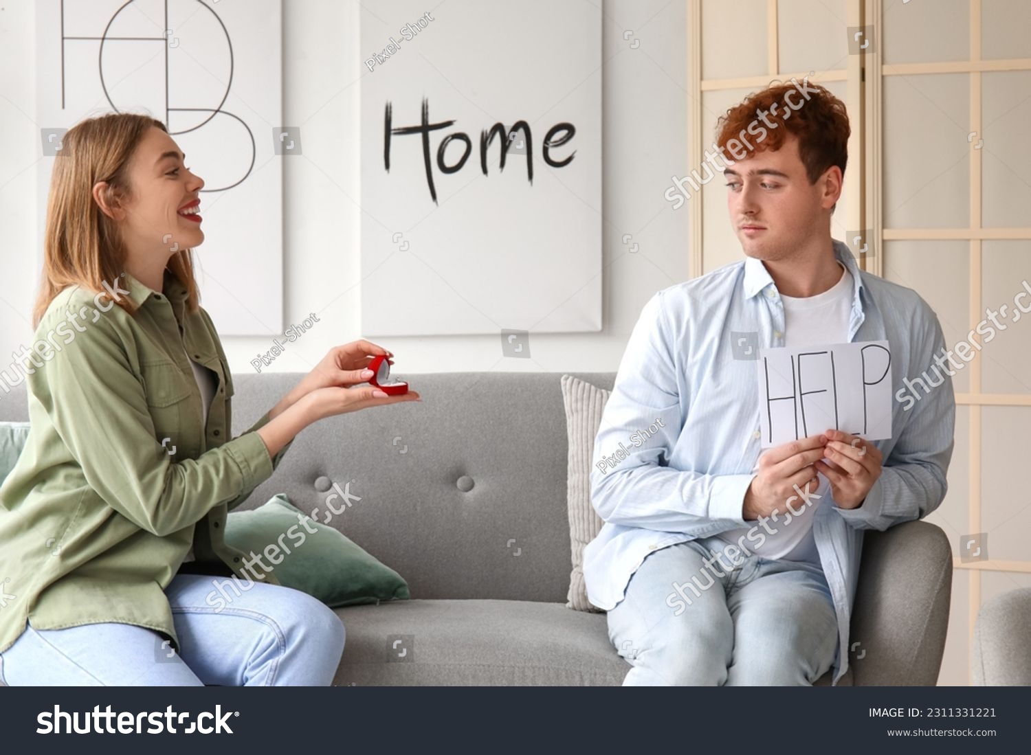 Young man with word HELP get proposed at home #2311331221