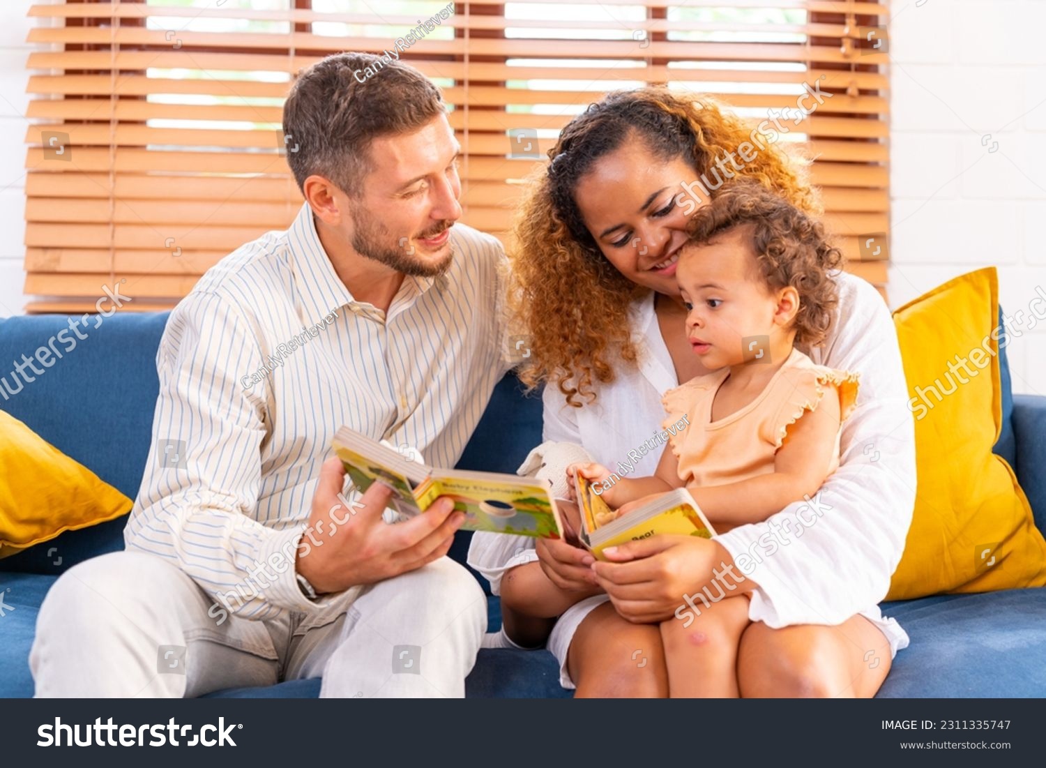 Happy family parents and child spending time together at home. Father, mother and little daughter playing together in living room at home on holiday vacation. Parenting and family relationship concept #2311335747