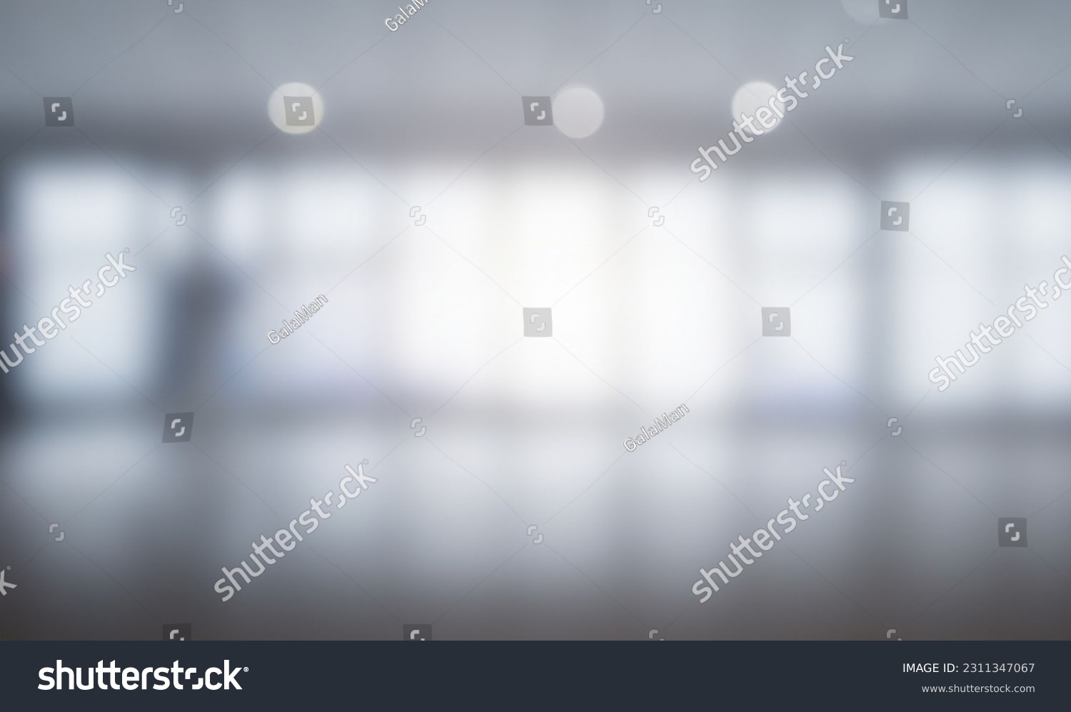 Blurred empty open space office. Abstract light bokeh at office interior background for design and table #2311347067