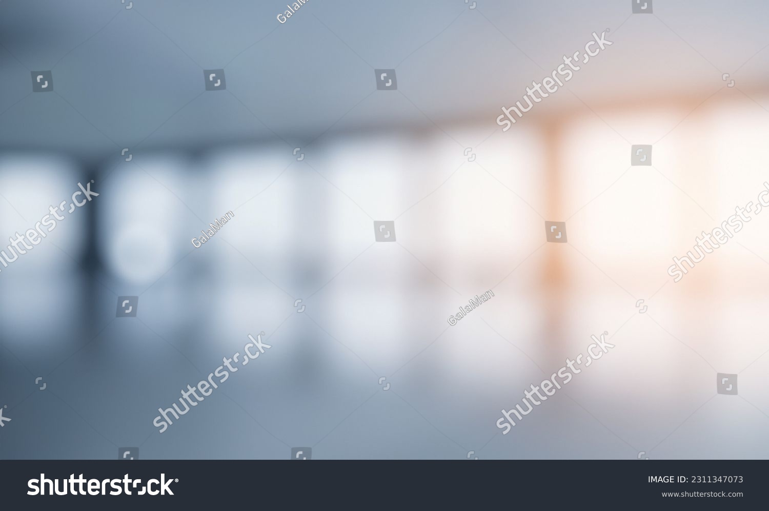 Blurred empty open space office. Abstract light bokeh at office interior background for design and table #2311347073
