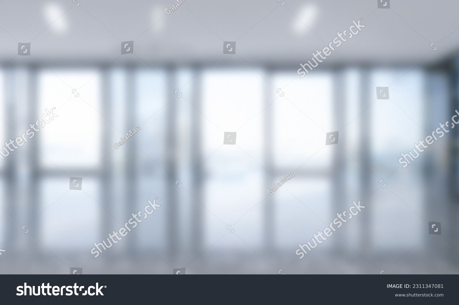 Blurred empty open space office. Abstract light bokeh at office interior background for design and table #2311347081