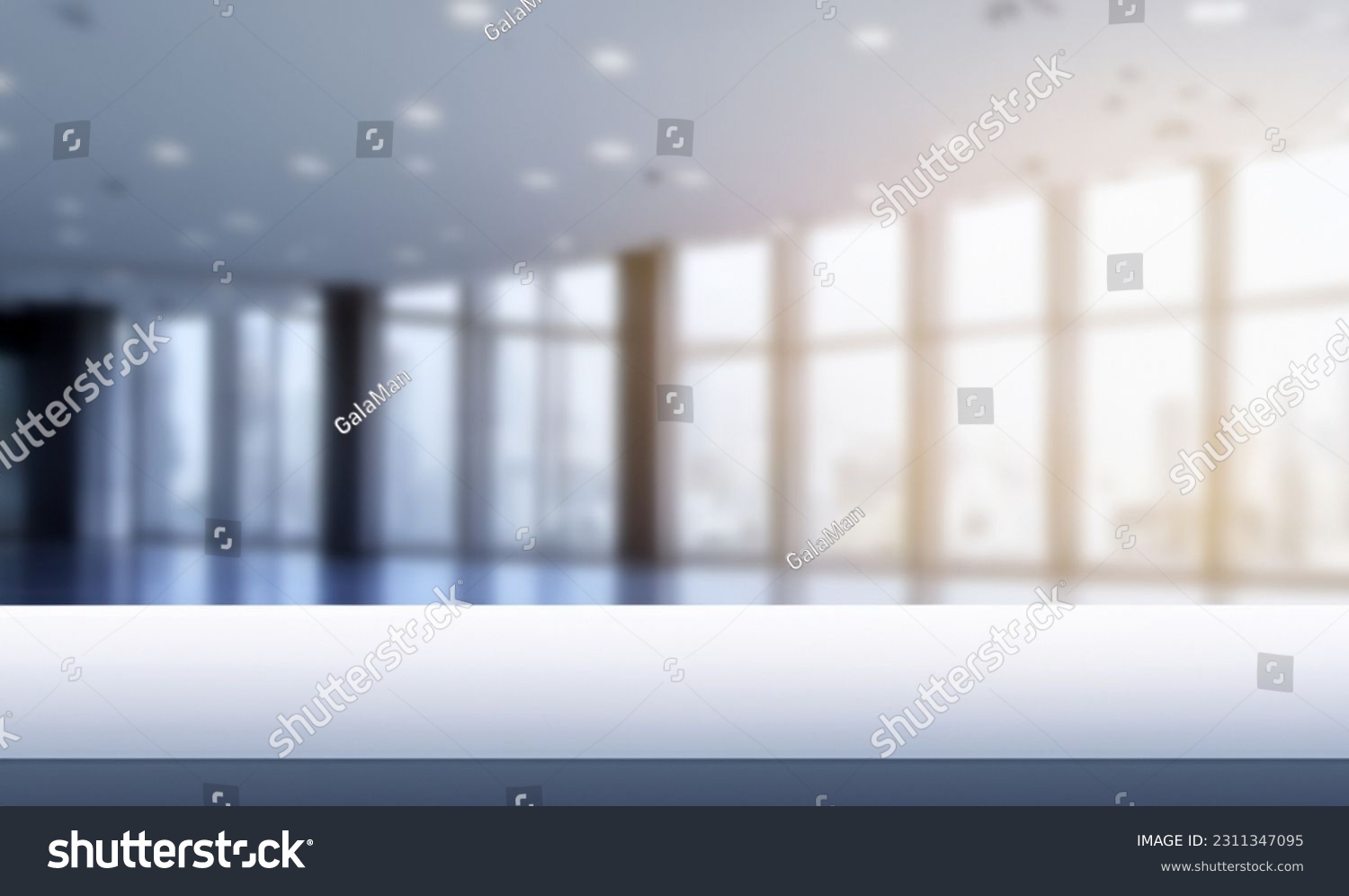 Blurred empty open space office. Abstract light bokeh at office interior background for design and table #2311347095