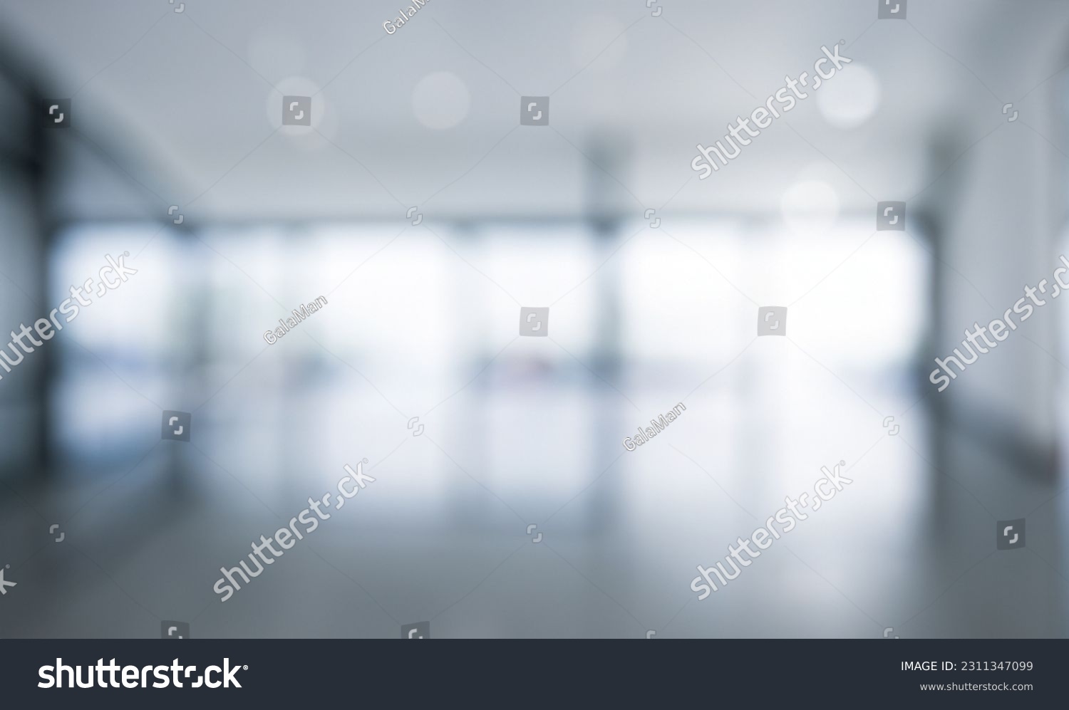 Blurred empty open space office. Abstract light bokeh at office interior background for design and table #2311347099