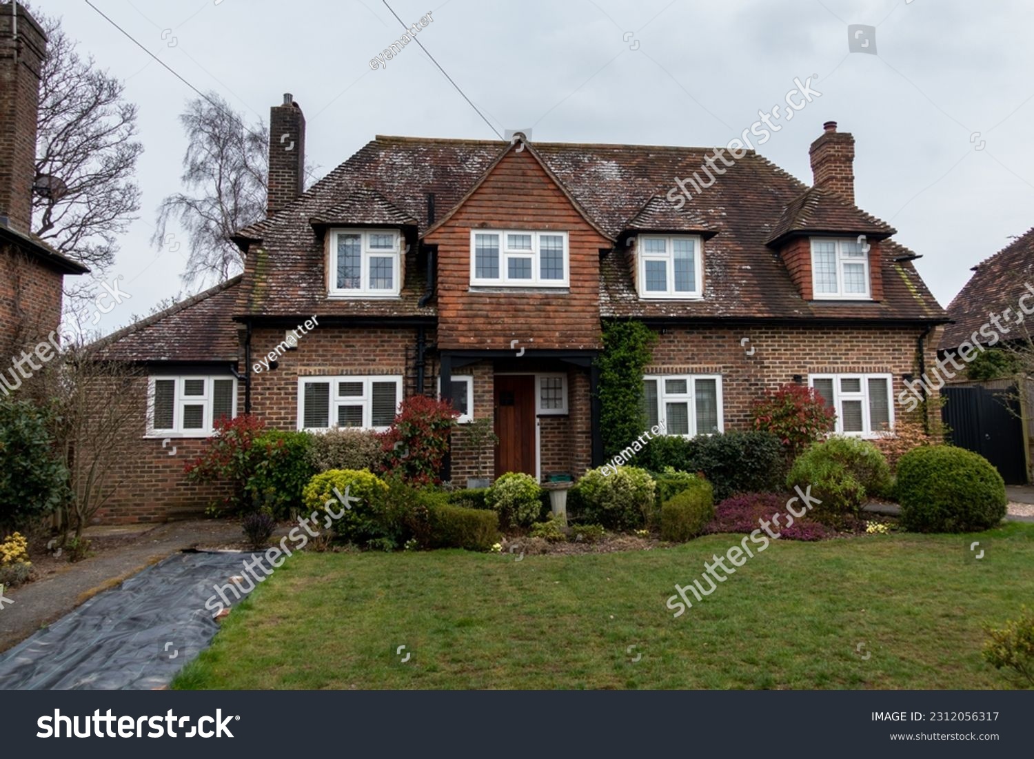 Quaint English brick built detached cottage style residence, with dormers and front facing gables #2312056317