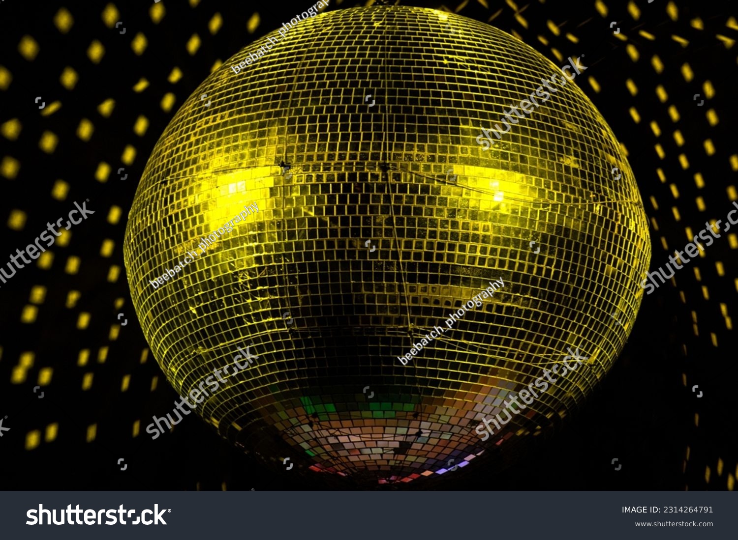 Giant Yellow disco ball in a club #2314264791