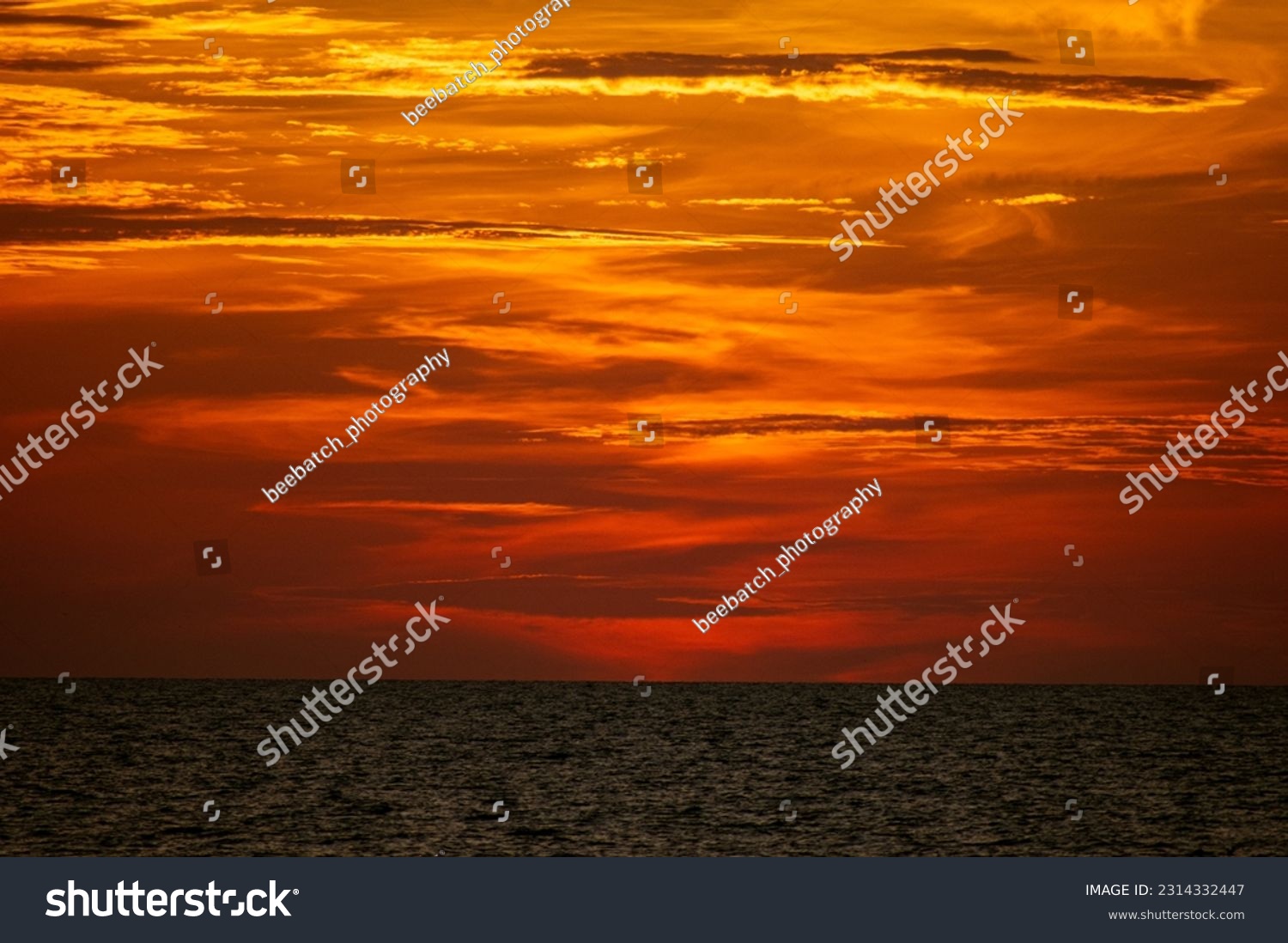 Orange sunset over the ocean #2314332447