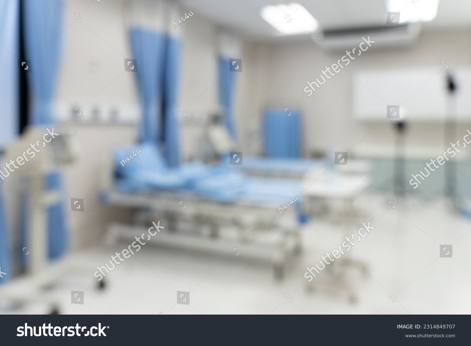 Blurred image background with Empty emergency room, intensive care room, intensive care unit, medical beds with equipment in hospital or clinic #2314849707