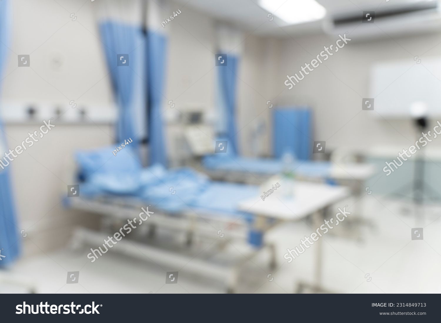 Blurred image background with Empty emergency room, intensive care room, intensive care unit, medical beds with equipment in hospital or clinic #2314849713