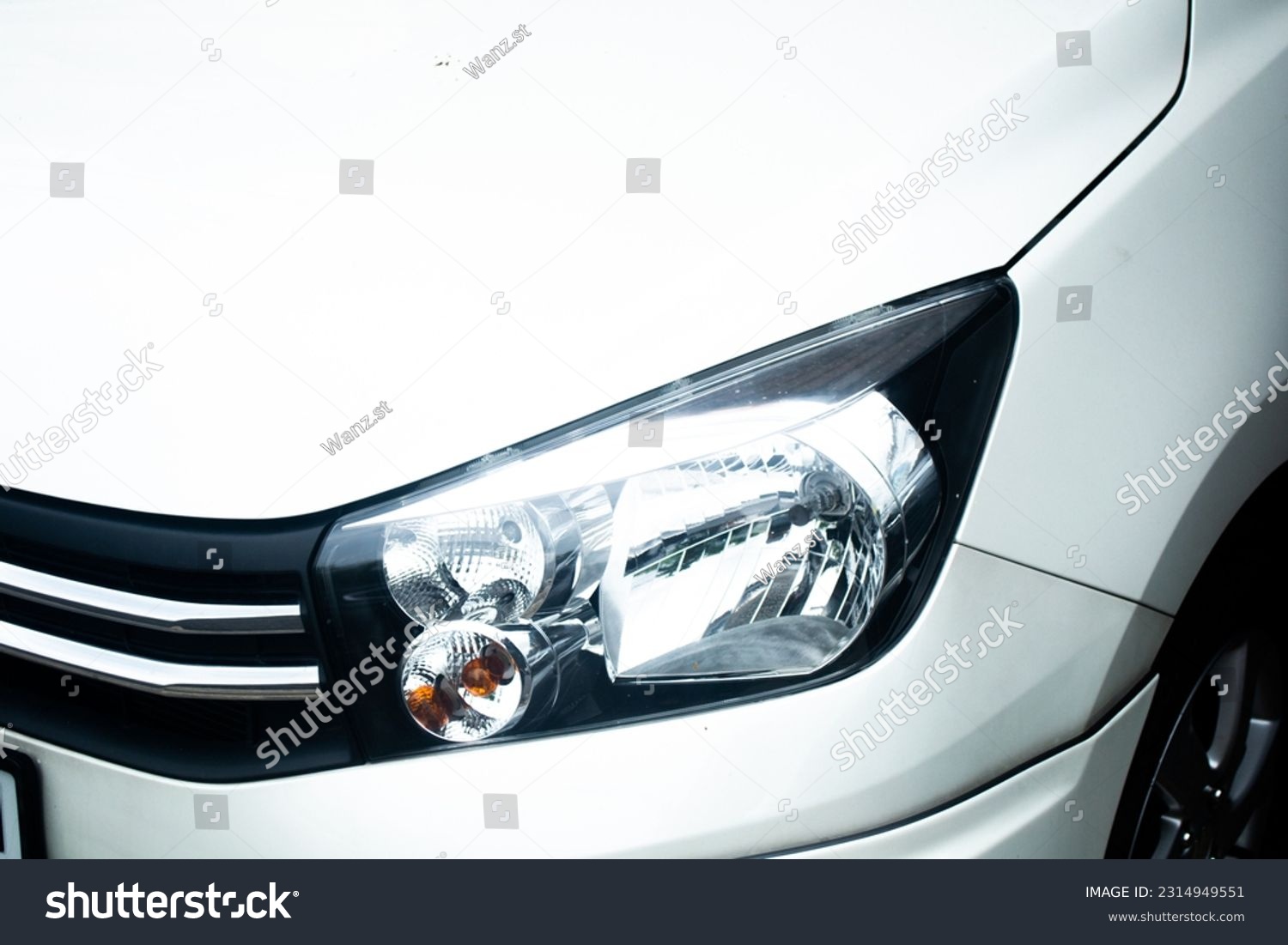 Close-up halogen head light. beauty clean headlights of white city car. #2314949551