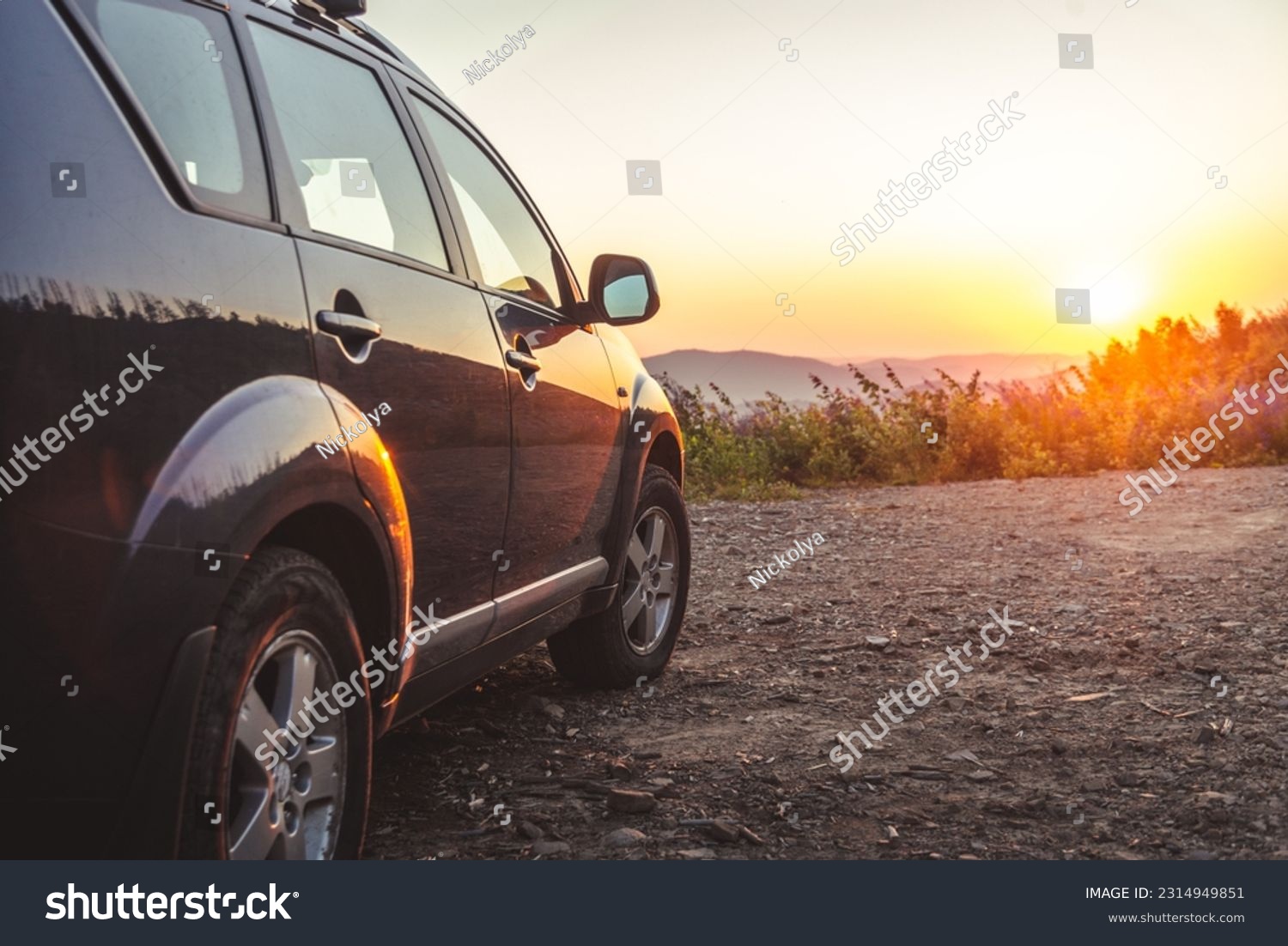 car for traveling with a mountain road. Sunset #2314949851
