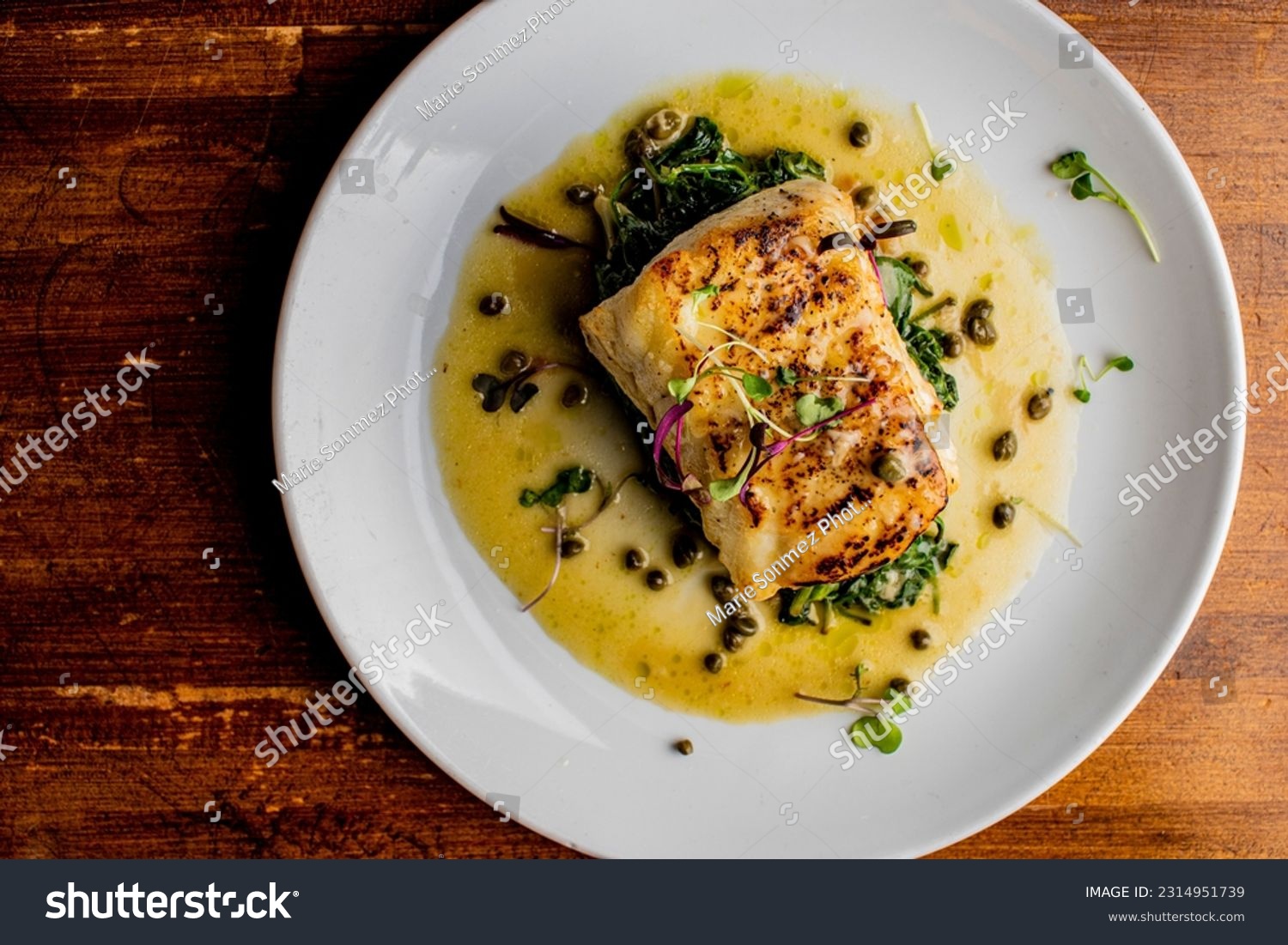 Grilled fish. Grilled red snapper. Traditional Classic American or French Seafood Restaurant menu item, whole grilled fresh caught halibut or sea bream Fish served with chilled gazpacho and peppers. #2314951739