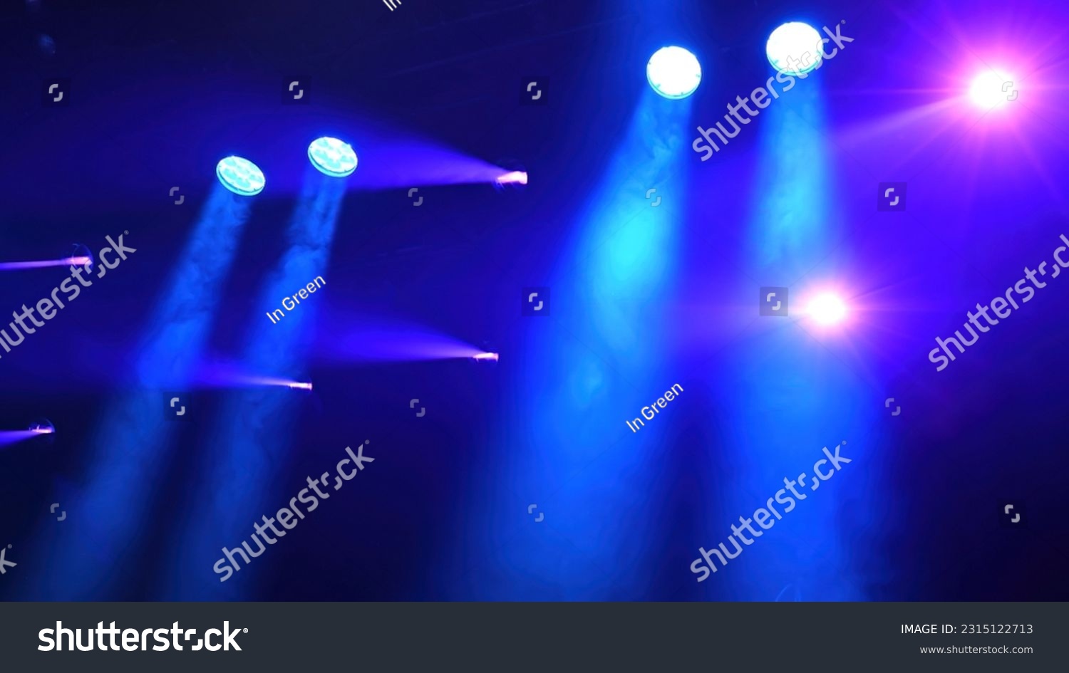 blue spotlights over the stage working during the concert #2315122713