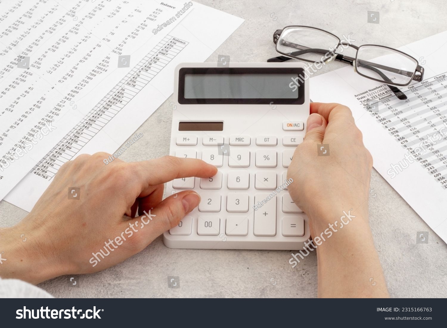 Office table with financial accounting and business planning with calculator. #2315166763